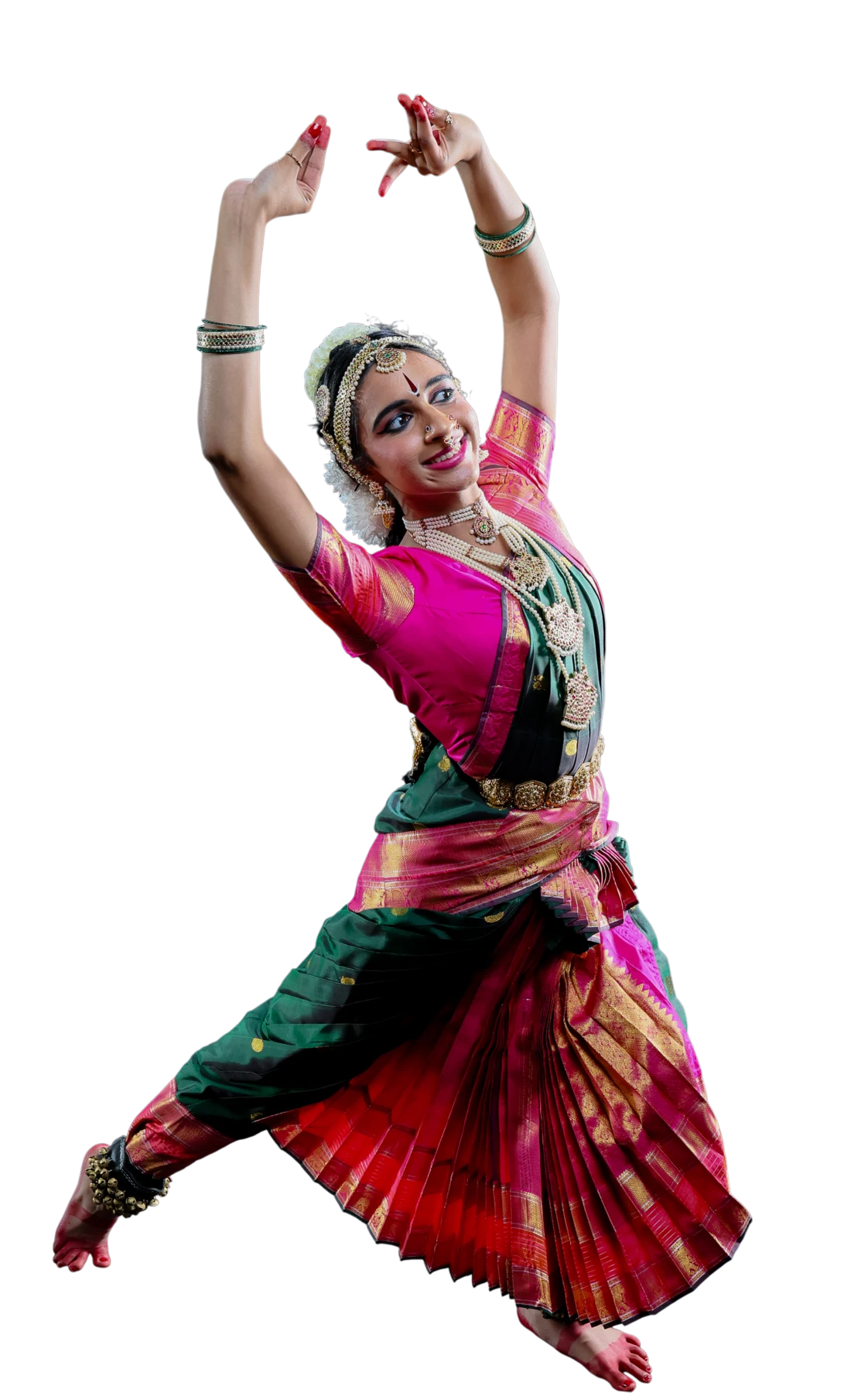 Shriya Natarajan in dynamic Bharatanatyam pose, arms raised overhead