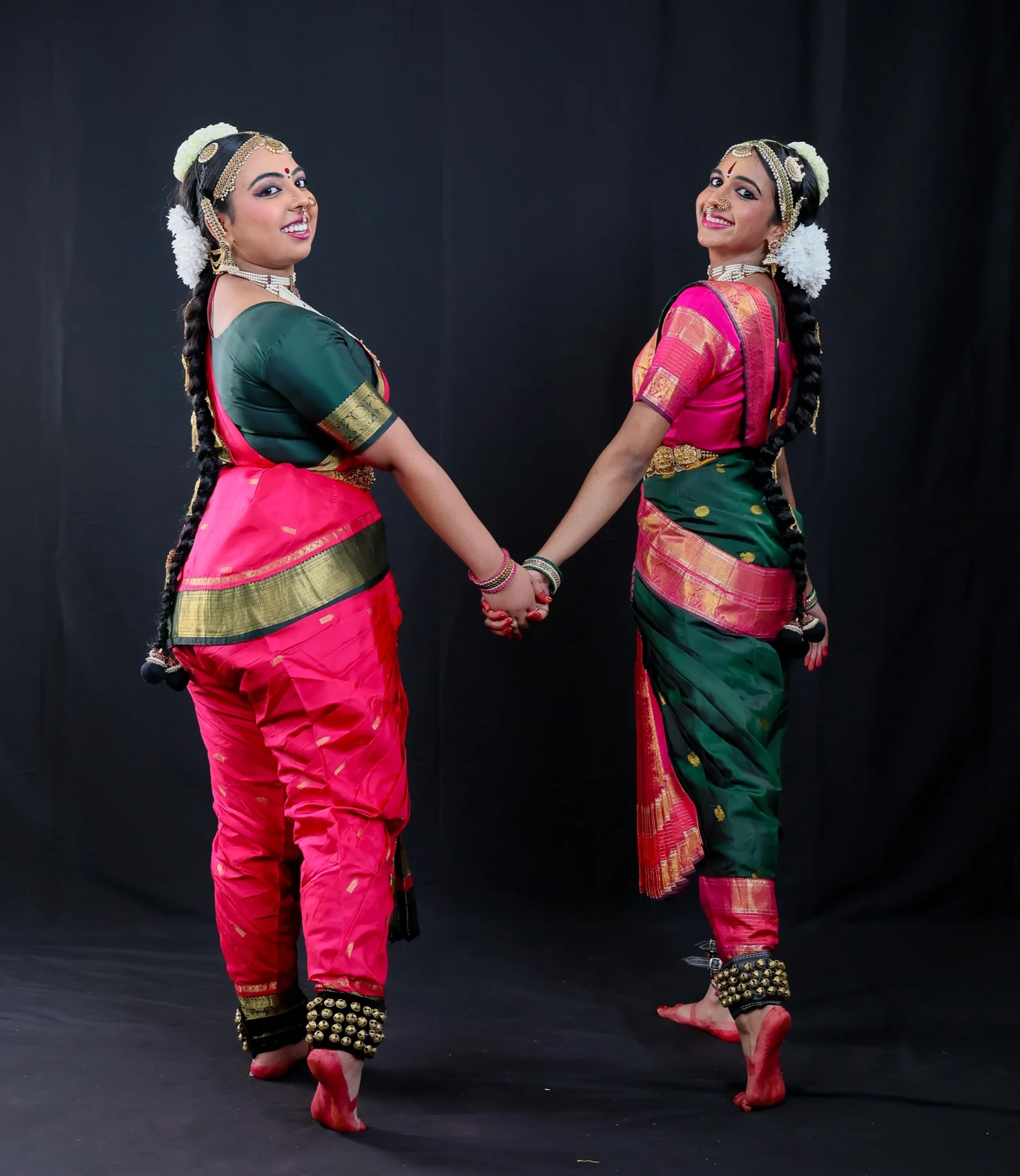 Shreya and Shriya holding hands in costume